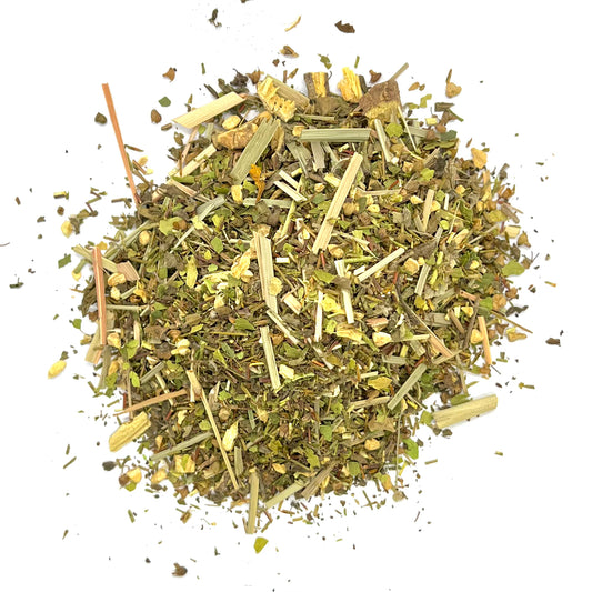 A mixture of dried herbs and leaves, including green rooibos, tulsi, ginger, liquorice, lemongrass, and lime leaves, indicative of a herbal tea blend.