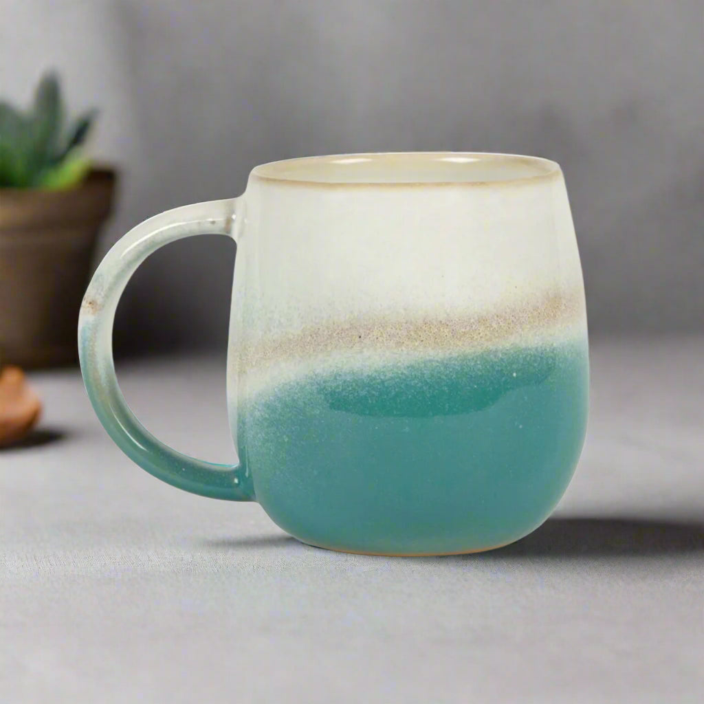 Ceramic mug with two-tone design on a white background