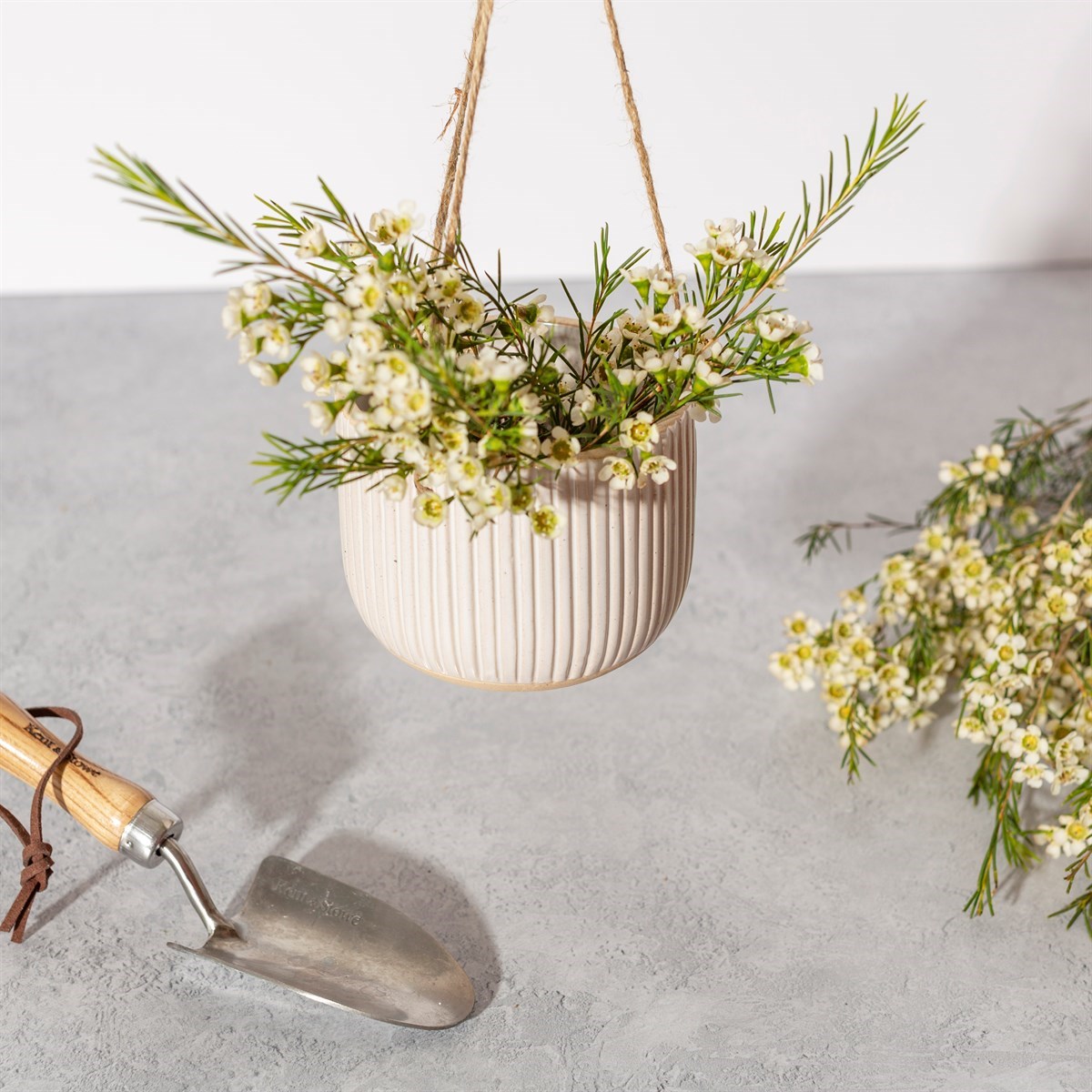 grooved off white hanging planter stoneware